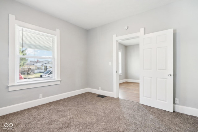 unfurnished bedroom with carpet floors