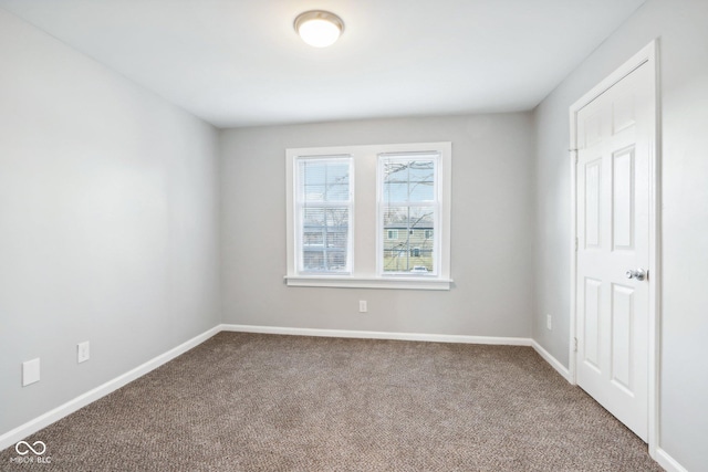 unfurnished room with carpet flooring