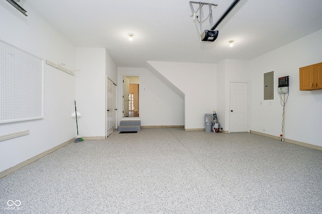 garage featuring a garage door opener and electric panel