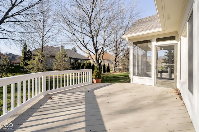 deck with a sunroom