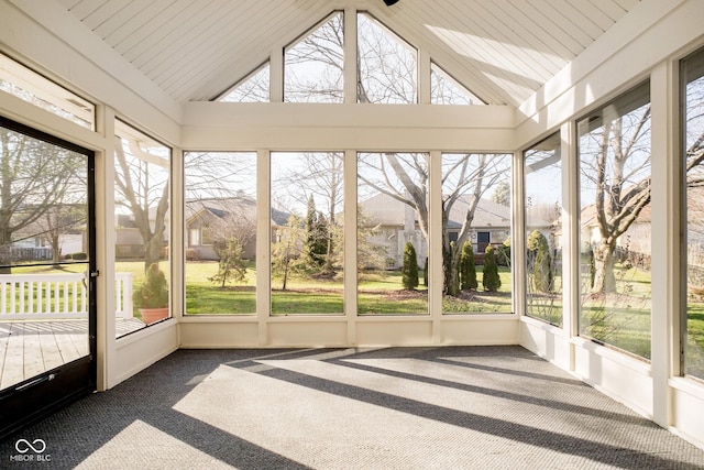 unfurnished sunroom featuring lofted ceiling