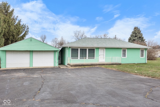 ranch-style home with a front lawn