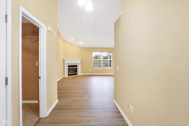 corridor with light wood-type flooring