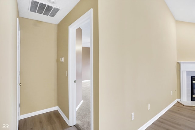 hall with hardwood / wood-style flooring