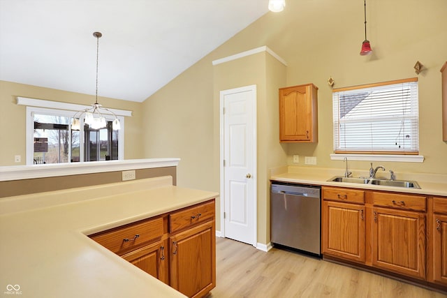 kitchen with dishwasher, pendant lighting, vaulted ceiling, and a wealth of natural light