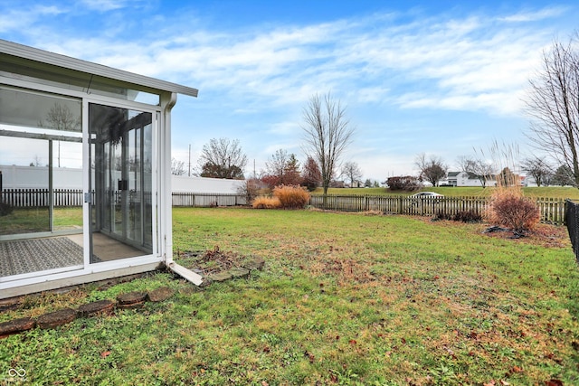 view of yard with a sunroom