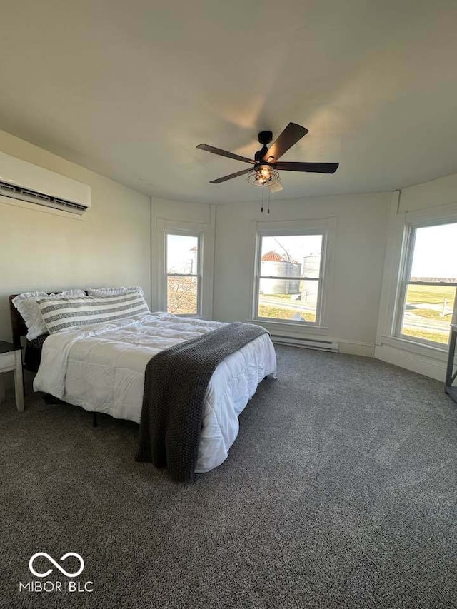 bedroom featuring ceiling fan, dark carpet, and a wall mounted AC