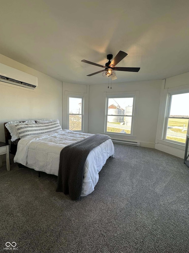 carpeted bedroom featuring a wall unit AC and ceiling fan