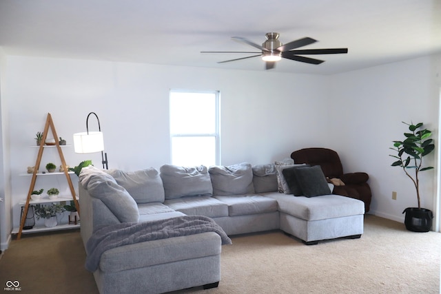 living room featuring carpet flooring and ceiling fan