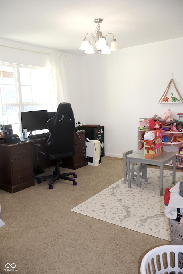 home office with carpet floors and a notable chandelier