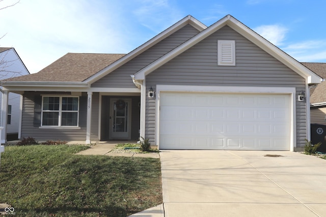 view of front facade featuring a garage and a front lawn