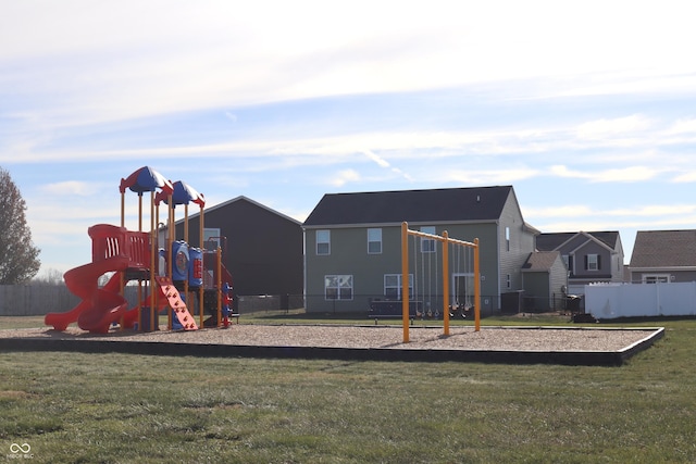 view of playground with a lawn