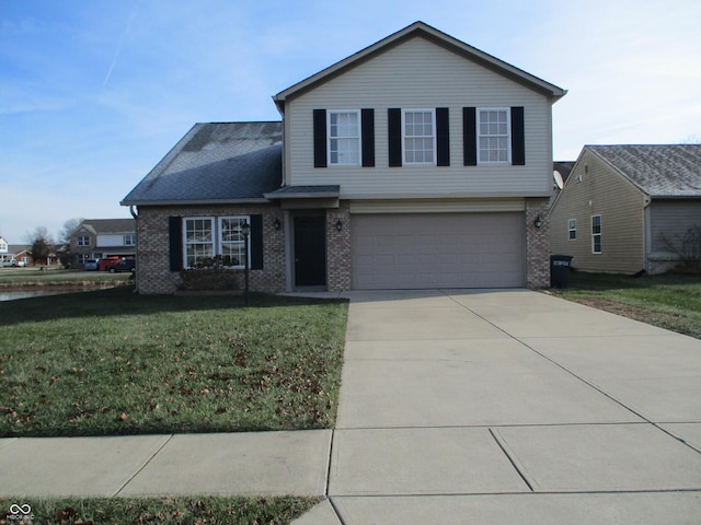 view of front of property featuring a front lawn and a garage