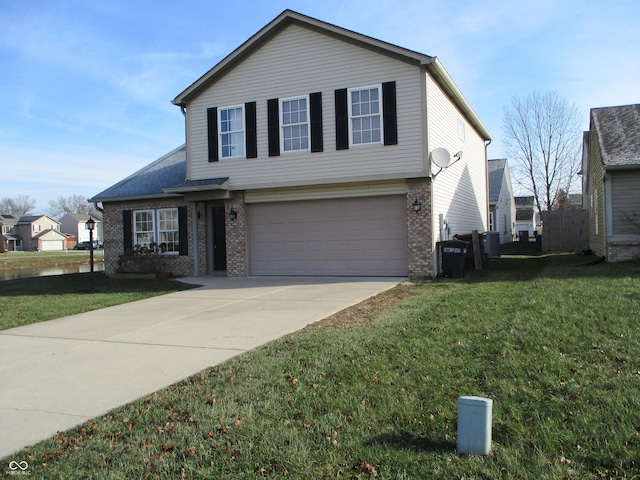 view of front of property with a front yard and a garage