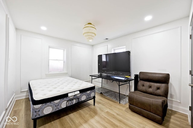 bedroom with light wood-type flooring