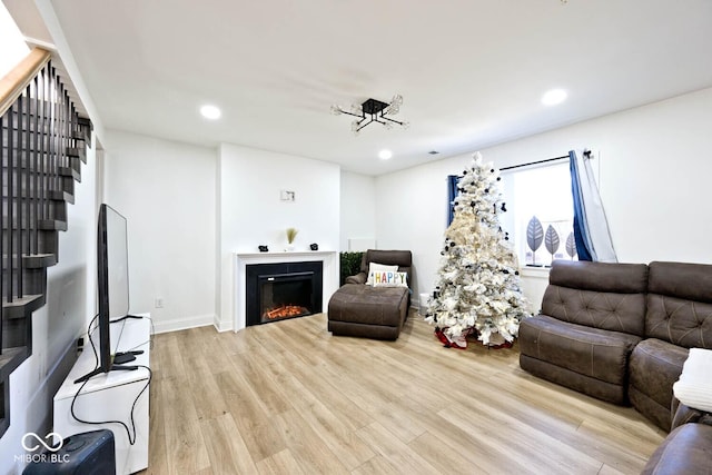 living room with light hardwood / wood-style flooring