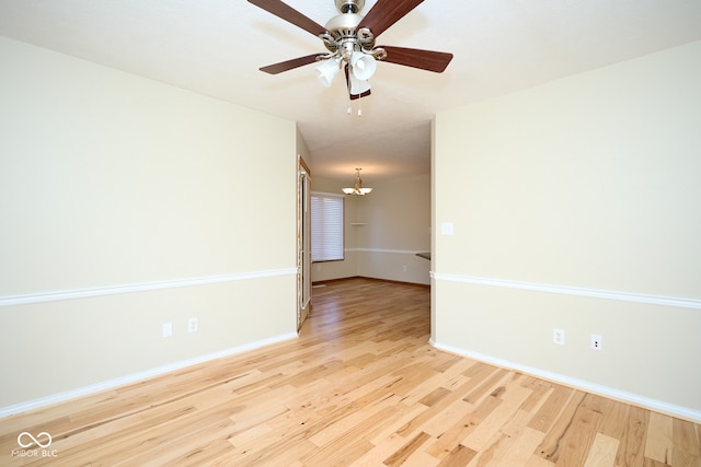 unfurnished room featuring ceiling fan and light hardwood / wood-style floors