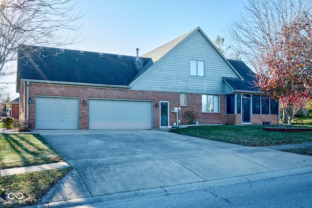 view of front of home featuring a garage and a front lawn