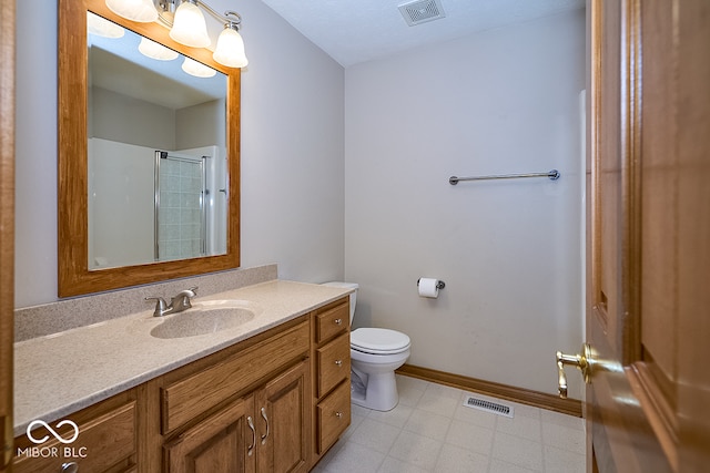 bathroom with vanity, toilet, and walk in shower