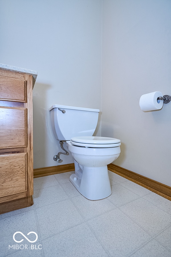 bathroom with tile patterned flooring and toilet