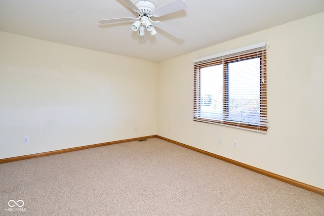 unfurnished room with carpet and ceiling fan