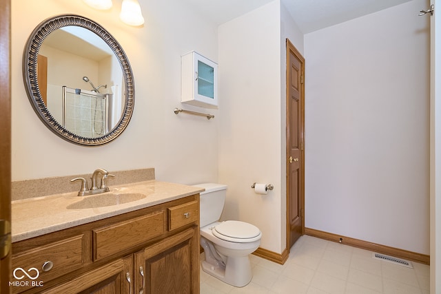 bathroom featuring vanity, toilet, and walk in shower