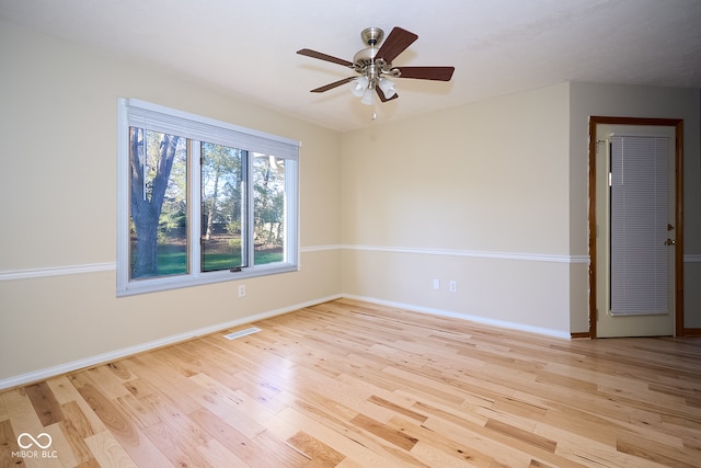 spare room featuring ceiling fan and light hardwood / wood-style flooring