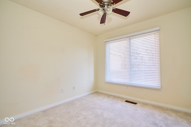 empty room with light carpet and ceiling fan