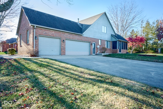 view of property featuring a garage and a front yard