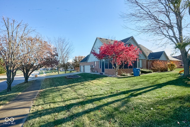 view of home's exterior with a lawn and a garage