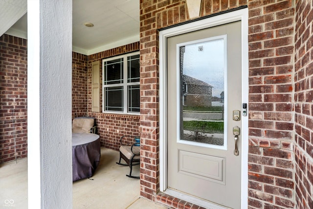 entrance to property featuring a porch