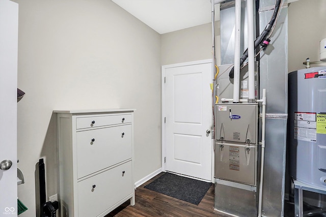 utility room featuring water heater