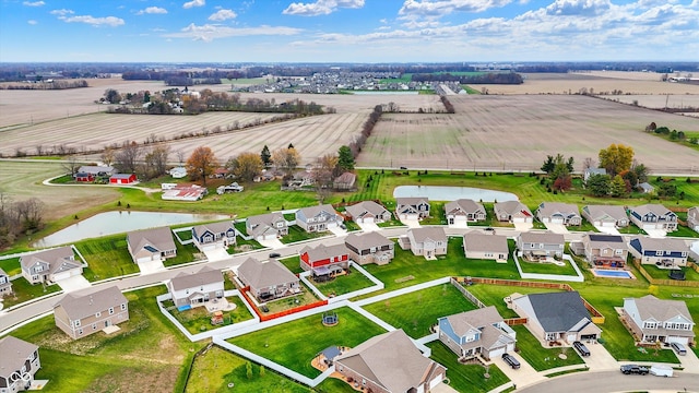 drone / aerial view featuring a rural view and a water view