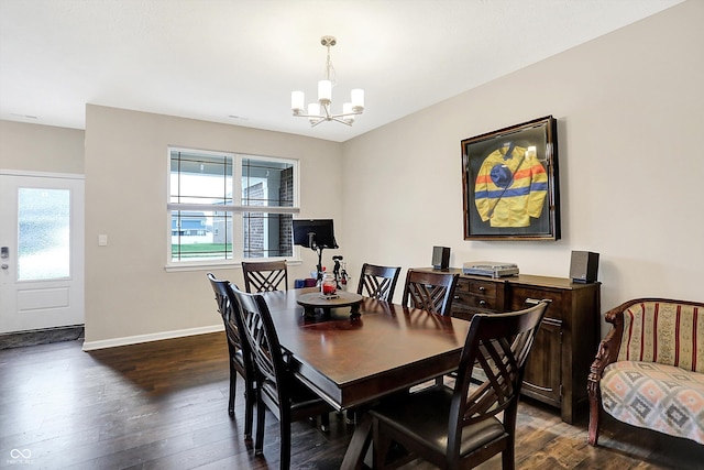 dining room with a notable chandelier and dark wood-type flooring