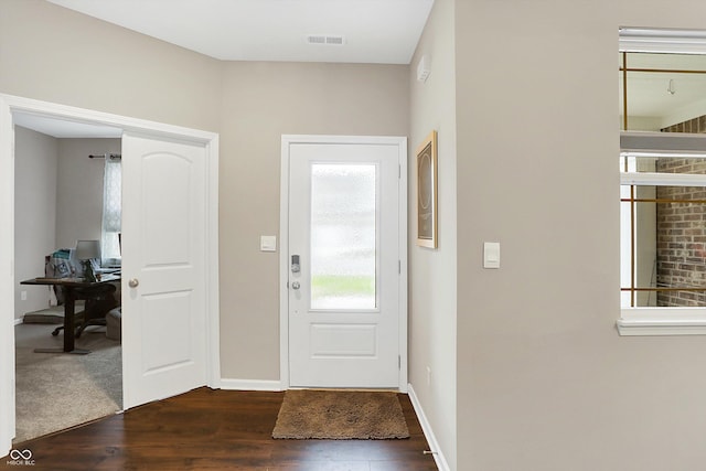 foyer entrance featuring dark hardwood / wood-style floors