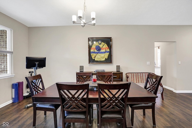 dining room with a notable chandelier and dark hardwood / wood-style floors