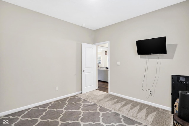 unfurnished bedroom with carpet flooring