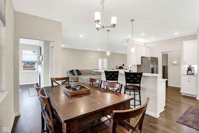 dining space featuring a chandelier and dark hardwood / wood-style floors