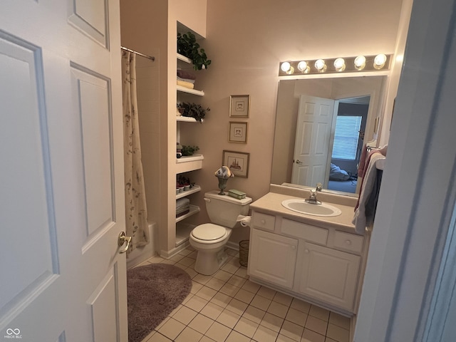 full bathroom featuring tile patterned flooring, vanity, toilet, and shower / bath combo with shower curtain