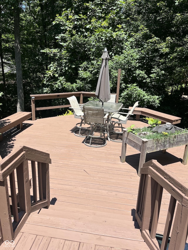 wooden deck featuring outdoor dining space