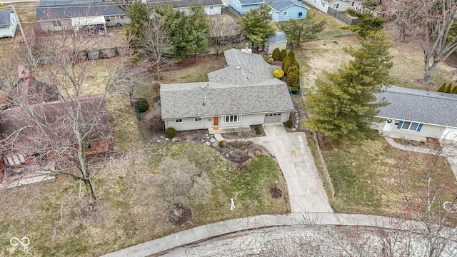 birds eye view of property with a residential view