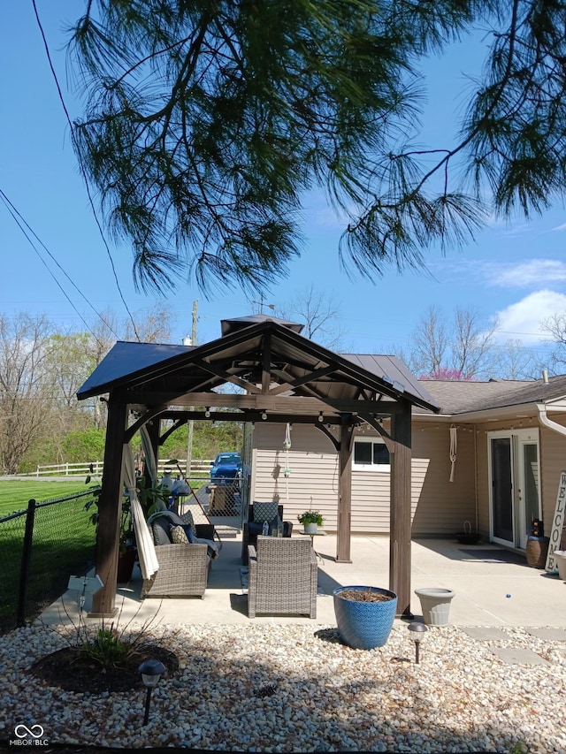 view of patio / terrace featuring an outdoor living space and a gazebo