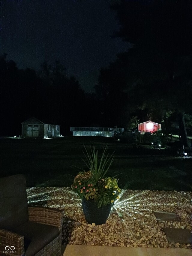 view of yard at twilight