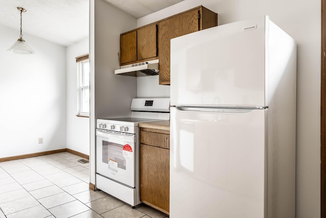 8016 Minlo Dr, Indianapolis, IN 46227 - kitchen featuring white appliances, under cabinet range hood, brown cabinetry, and hanging light fixtures