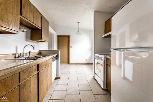8016 Minlo Dr, Indianapolis, IN 46227 - kitchen with white appliances, a textured ceiling, under cabinet range hood, light tile patterned flooring, and hanging light fixtures