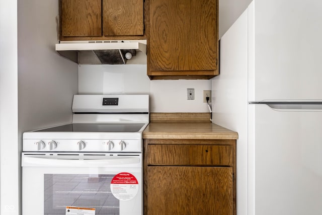 8016 Minlo Dr, Indianapolis, IN 46227 - kitchen with white appliances, ventilation hood, brown cabinetry, and light countertops