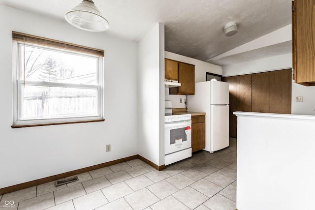 8016 Minlo Dr, Indianapolis, IN 46227 - kitchen with white appliances, lofted ceiling, under cabinet range hood, light tile patterned floors, and a textured ceiling
