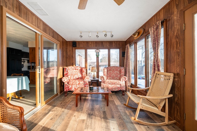 sunroom / solarium with ceiling fan