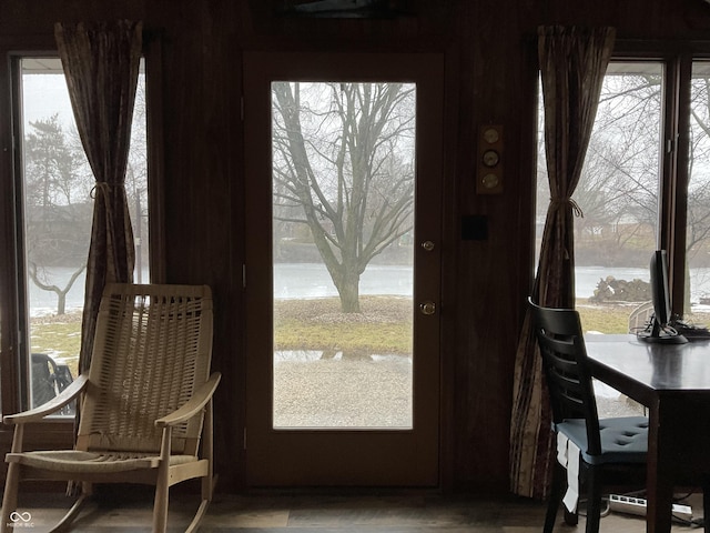 doorway to outside with a water view