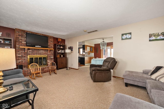 carpeted living room with a textured ceiling and a fireplace